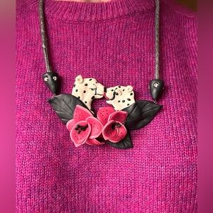 Vintage artisan made polymer clay kissing leopards necklace